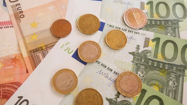 Euro banknotes and coins — Stock Photo, Image