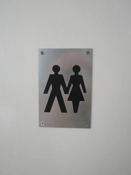 Mann Und Frau Halten Hand Hand Toilettenschild — Stockfoto