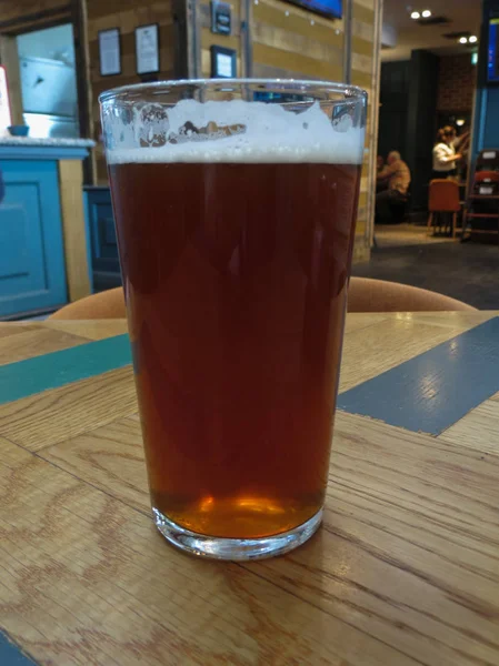 a pint of British ale beer in a pub