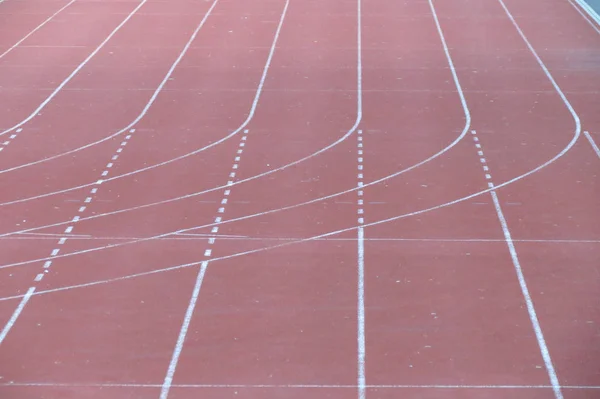 All-weather running track perspective useful as sport or competition concept