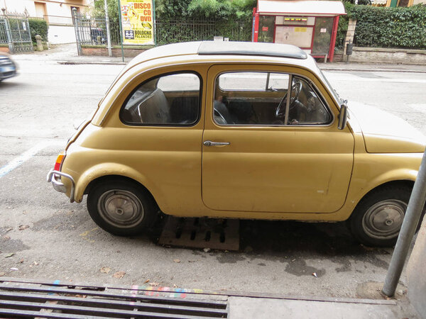 BOLOGNA, ITALY - CIRCA NOVEMBER 2014: yellow Fiat 500 car