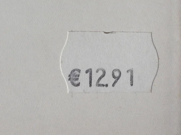 printed price tag label over white background