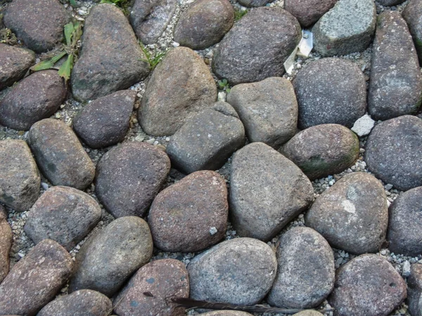 Ein Kopfsteinpflaster Als Hintergrund — Stockfoto