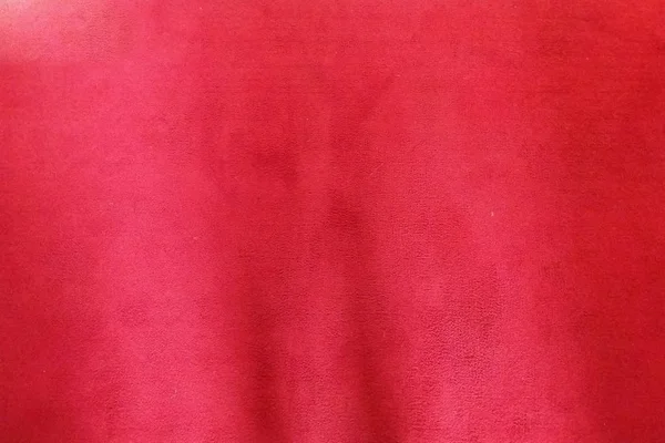 Red nonwoven polypropylene fabric surface background — ストック写真