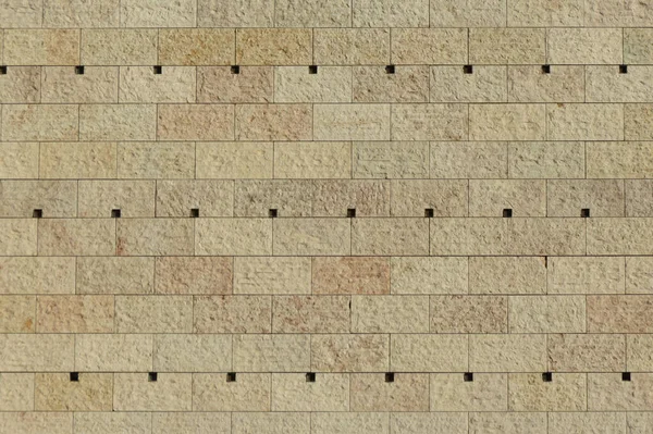 背景として役に立つベージュ石の壁 — ストック写真