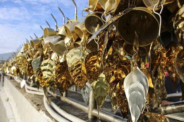 Traditional Buddhist wind bells hanging near Golden Rock, Myanma