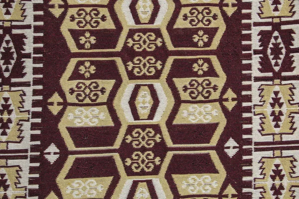 Old traditional Jordan carpet with a geometric pattern in dark r — Stock Photo, Image