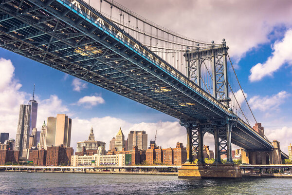 Manhattan Bridge on Hudson River with cityscape background, New York City