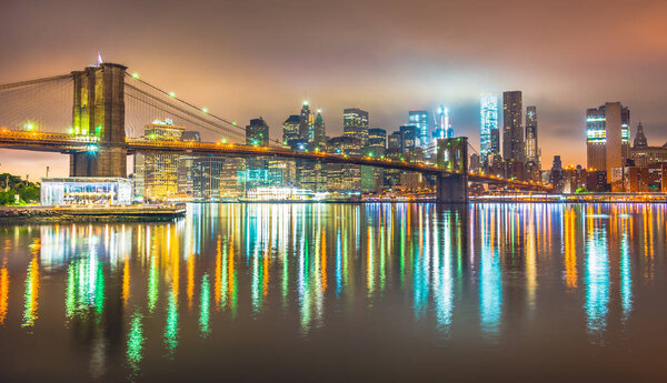 Night New York City Manhattan , view from Brooklyn, skyline panorama with Brooklyn Bridge