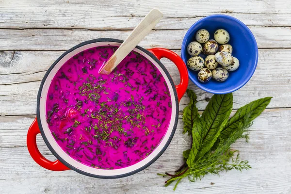Cold soup with beetroot and quail eggs on wooden table. — Stock Image Cold Soup Beetroot Quail Eggs Wooden Table Royalty Free Stock Photos