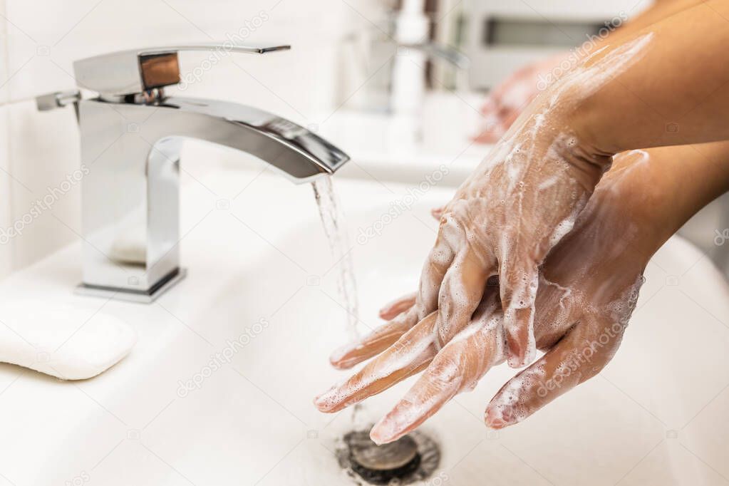Washing hands with soap for coronavirus prevention, hygiene to stop spreading coronavirus.