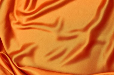 parlak turuncu ipek kumaş taşan