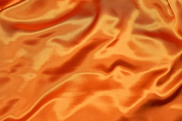 Tela de seda naranja brillante desbordante — Foto de Stock
