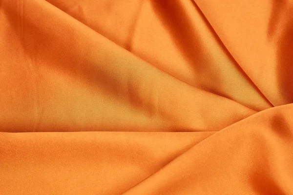 Jasny pomarańczowy tkaniny jedwabne, przepełnione — Zdjęcie stockowe