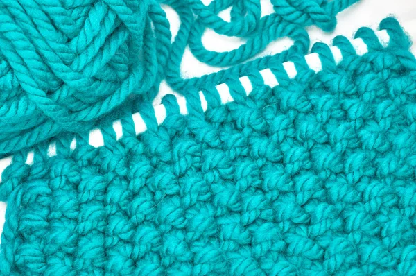 Sweater or scarf texture large knitting. Knitted jersey background with a relief pattern. Braids in knitting. Wool hand-knitted or machine knitting pattern. Fabric Background.