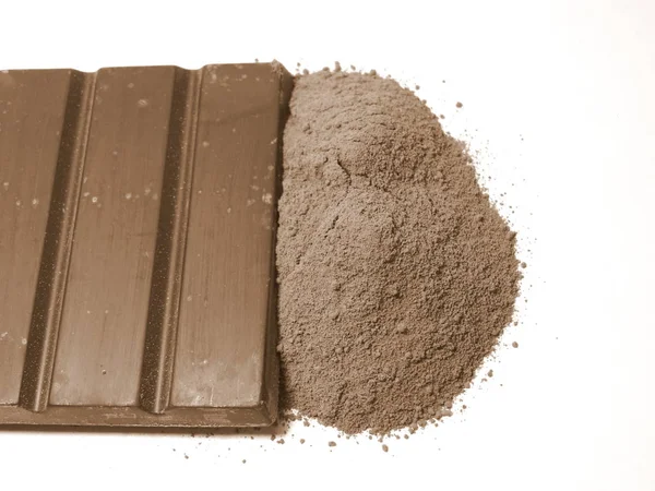 Barra di cioccolato e polvere — Foto Stock