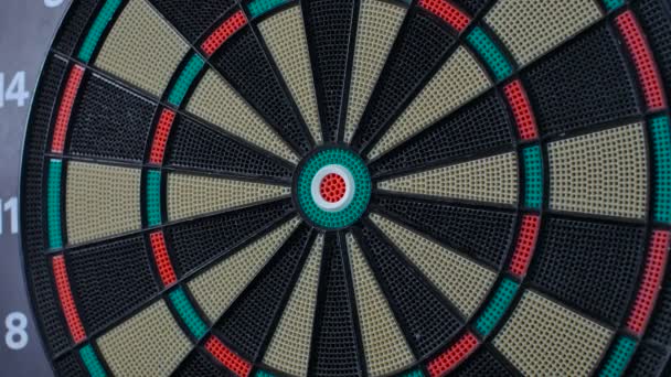 A dart arrow stick on the center of dart board. bull eye — Stock Video