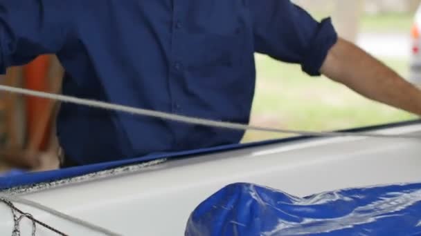 Senior fisherman preparing his gear on boat — Stock Video