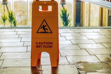 The sign of yellow color is carefully slippery near the swimming clipart