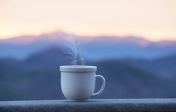 Morning coffe cup with alpine mountain view