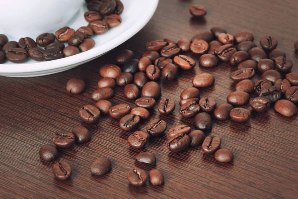 Cup of coffe beans on a table — Stock Photo, Image
