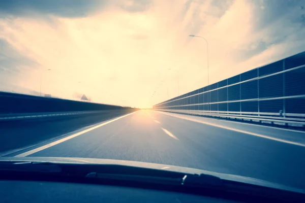 Car view with motion blur road background — Stock Photo, Image