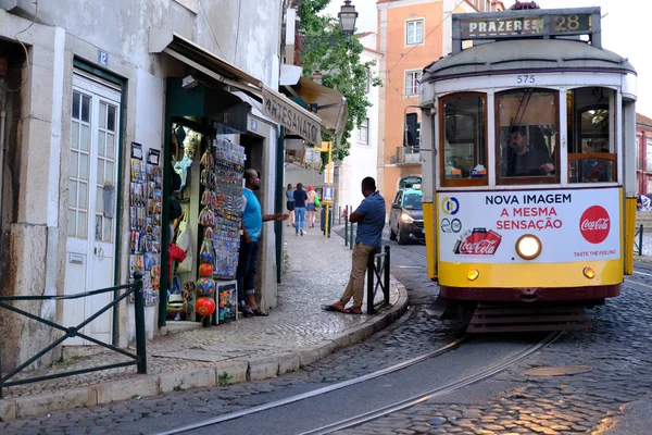 Traditional yellow tram at old streets — Stock Photo, Image