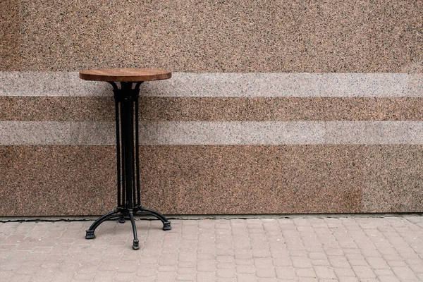 Table over wall background — Stock Photo, Image