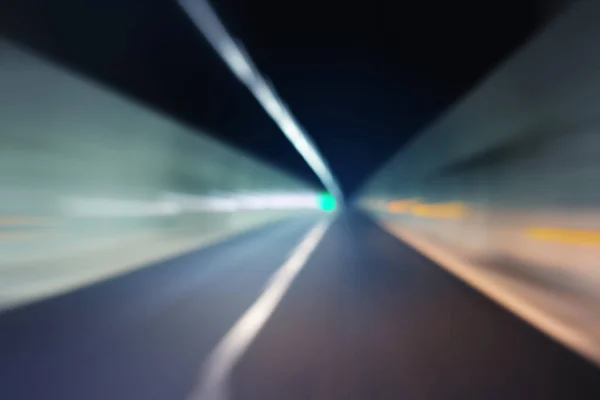 Blurred motion through dark tunnel — Stock Photo, Image