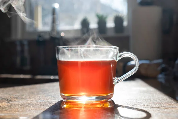 Hot Aromatic Tea Glass Cup Steam Kitchen Table Sunlight — Stock Photo, Image