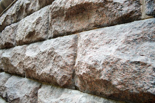 Grandes tijolos de pedra cinza vista lateral, fundo — Fotografia de Stock