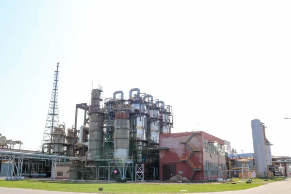 Chemical plant for the processing of petroleum products with rectification columns, reactors, heat exchangers, pipes, pumps, tanks at an oil refinery, petrochemical, chemical plant.