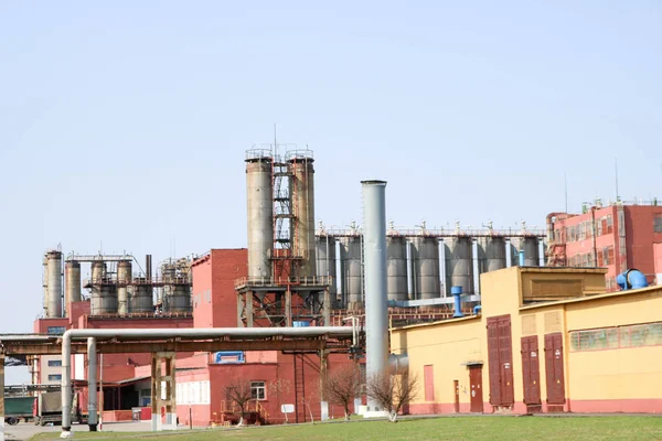 Chemical plant with rectification columns, reactors, heat exchangers, pipes, tanks, equipment, production buildings at an oil refinery, petrochemical, chemical plant.