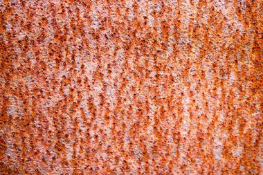 Paslı kahverengi eski eski eski eski eski oksitlenmiş metal, şişkinlikler, çukurlar ve desenler, arka plan ile demir Doku.