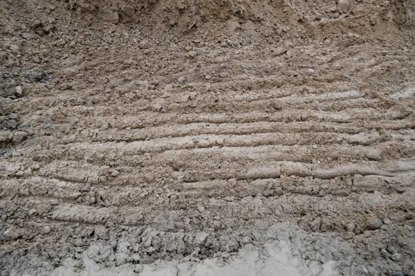 View of brown cracked natural moist earth clay. The background. Texture — 스톡 사진