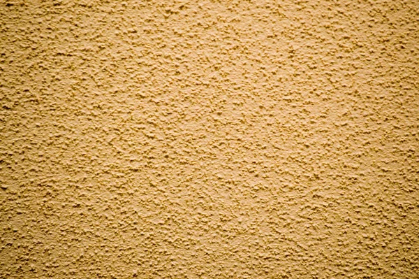 Wall of yellow rough embossed building decorative stucco. Texture, background — 스톡 사진