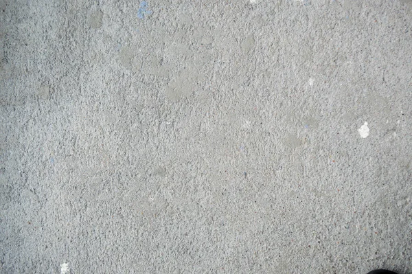 Wand aus grauem massivem, rostigem, geprägtem Baubeton. Textur, Hintergrund — Stockfoto