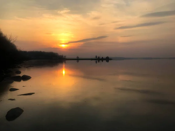 Beautiful red sunset over the horizon of the water in the river, sea, ocean, lake