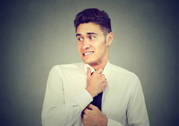 Nervous young man feels awkward looking away anxiously — Stock Photo, Image