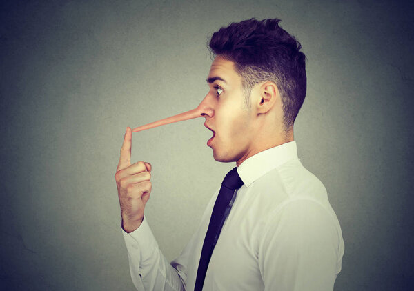 Business man with long nose. Liar concept. 
