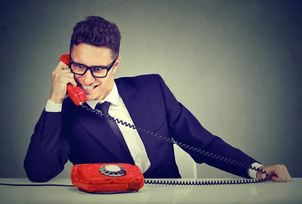 Pushy salesman business man advertising his best product on a phone — Stock Photo, Image