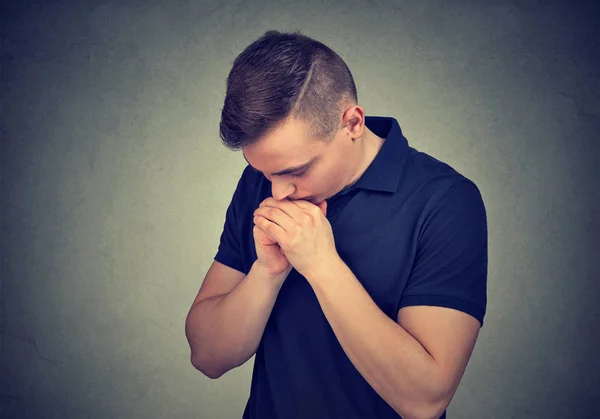 Young man praying in silence — Stock Photo, Image