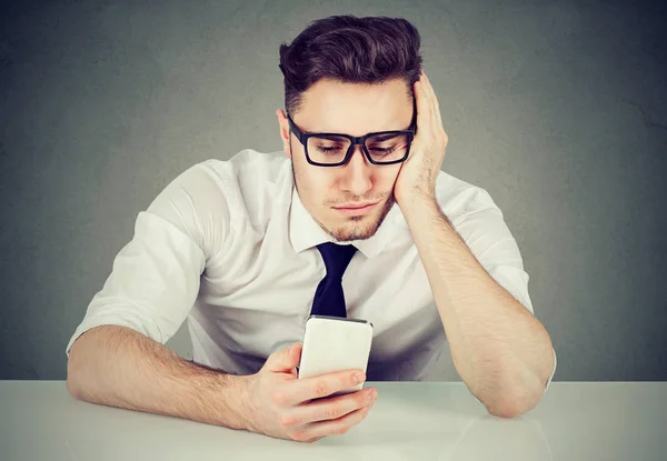 Young man procrastinating with social network — Stock Photo, Image