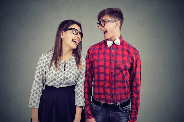 Portrait of a handsome man and cute girl looking at each other with wide smiles — Stock Photo, Image