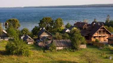 Small village Nanosy and lake Naroch, Belarus clipart