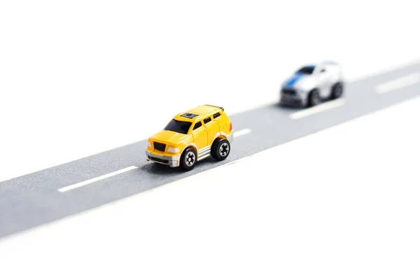 Two Small Cars Paper Road Wite Background Traffic — Stock Photo, Image