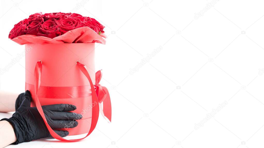Luxury red roses in paper hat box and boom with heart on white. Romantic gift for girl or woman or girl. Valentine`s day