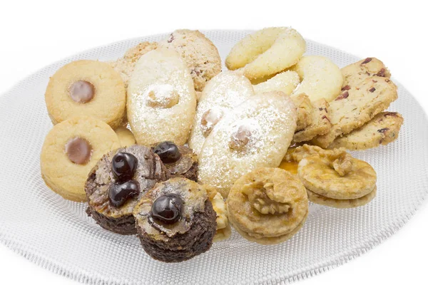 Christmas cookies on a glass plate, shot taken with large depth of field (DOF) — Stock Photo, Image