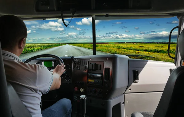 The truck driver on the road among fields highway. business trip — Stock Photo, Image