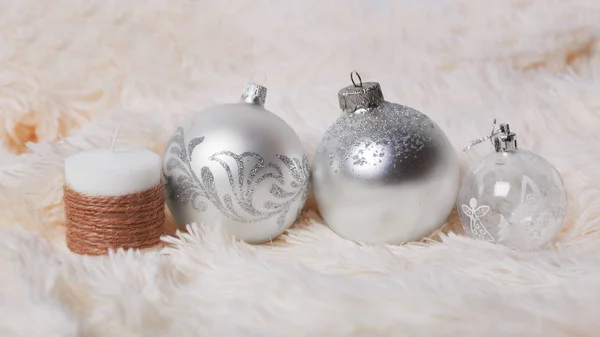 Christmas concept - silver christmas balls and decorative candle — Stock Photo, Image